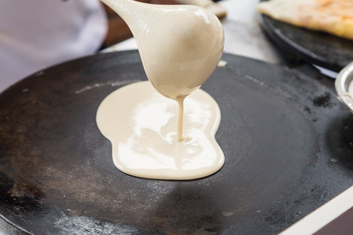 Pouring crepe dough